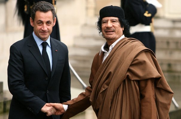 664432_france-s-president-nicolas-sarkozy-greets-libyan-leader-muammar-gaddafi-in-the-courtyard-of-the-elysee-palace-in-paris